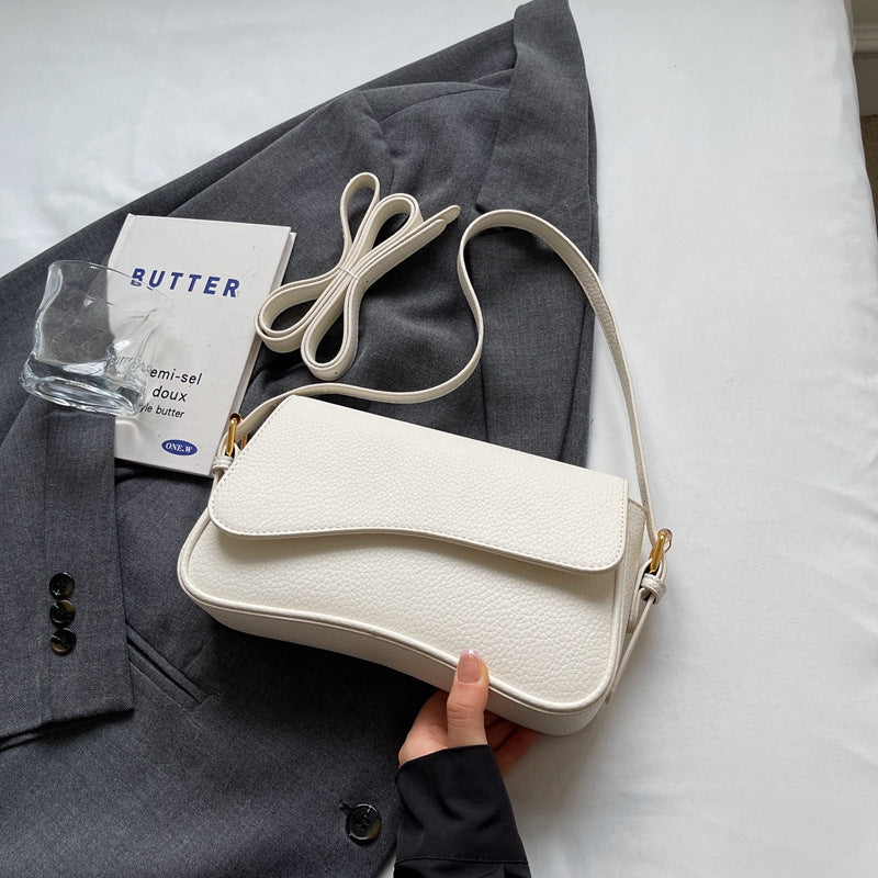 Zoëy | Elegante borsa a mano ondulata realizzata in pregiata pelle vegana 1